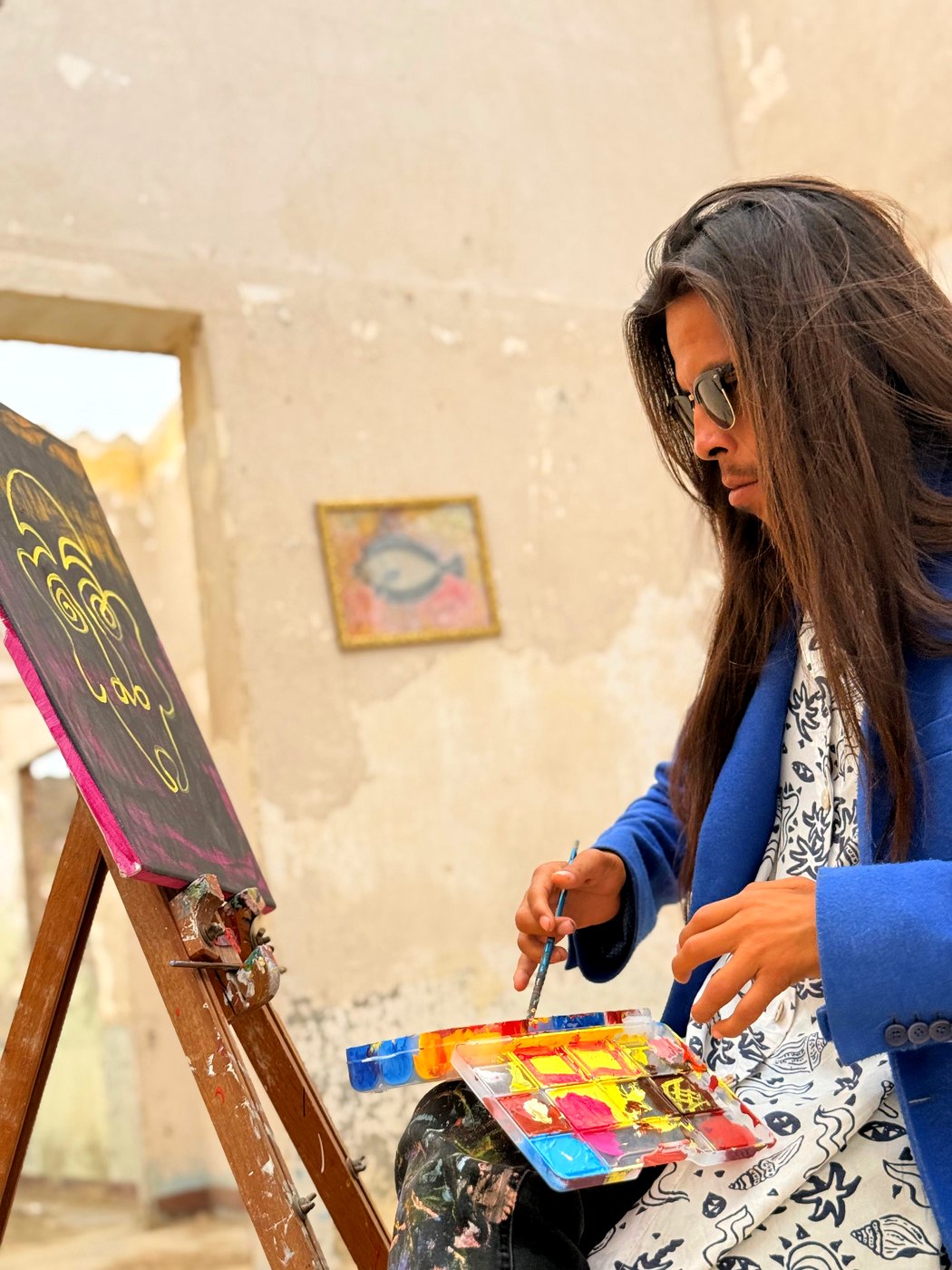 An artist at work inside Kapchay